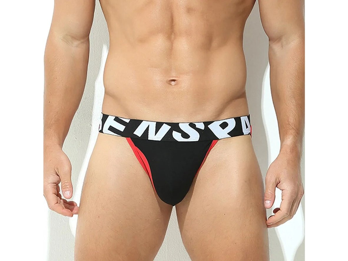 Black and red low-rise jockstrap with natural lighting shadows