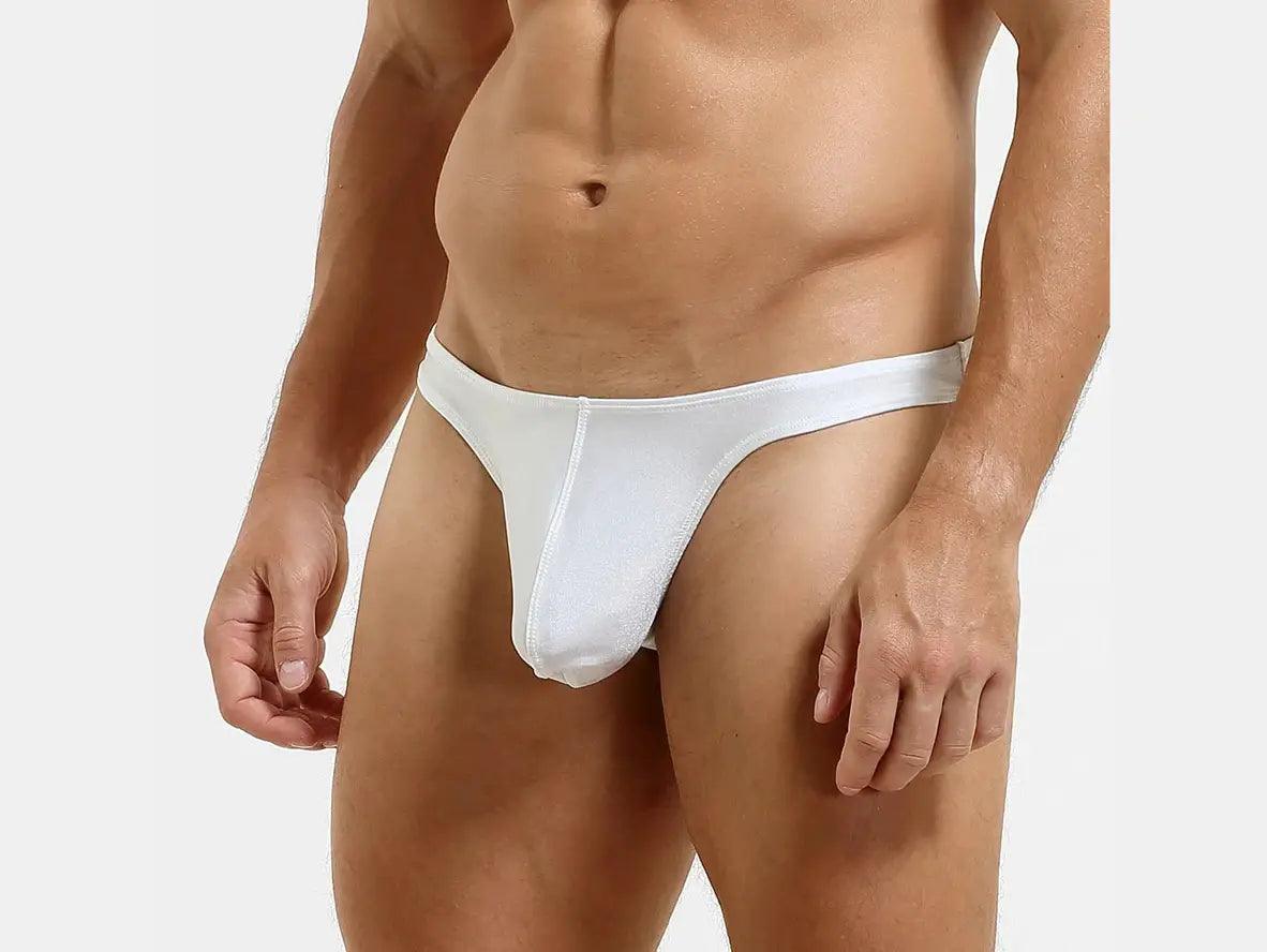 White low-rise thong front view with flat waistband and visible front seam detail