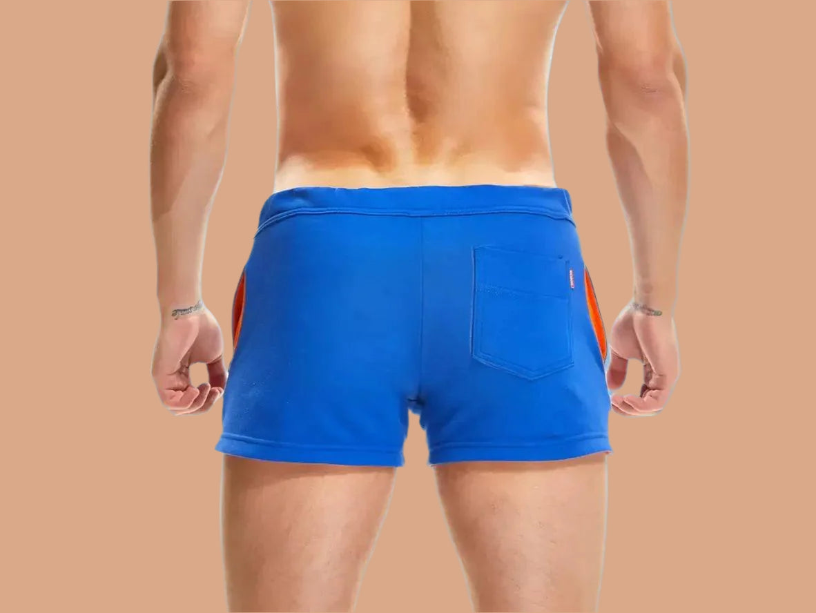 Bright blue shorts with orange side accents and rear pocket back view