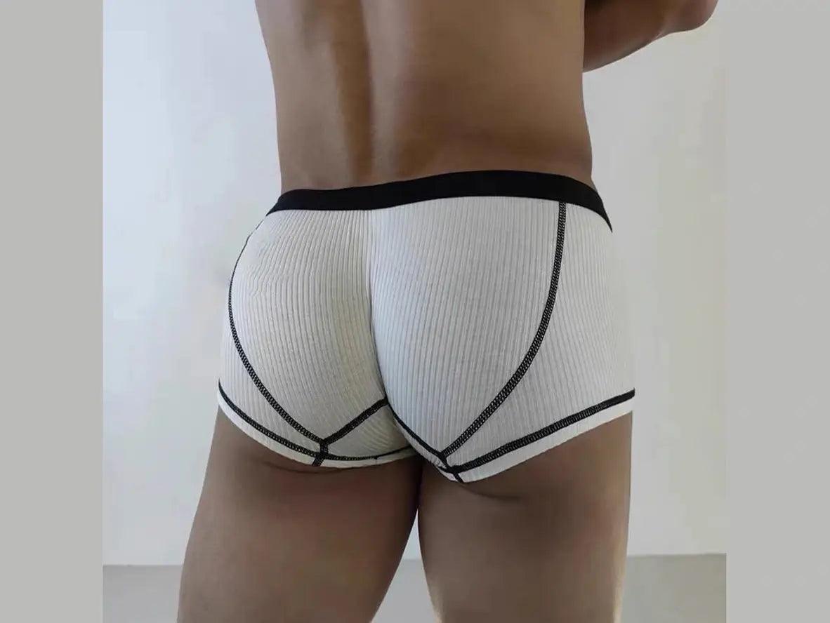 White ribbed low-rise boxer briefs showing curved Y-back stitching and snug fit