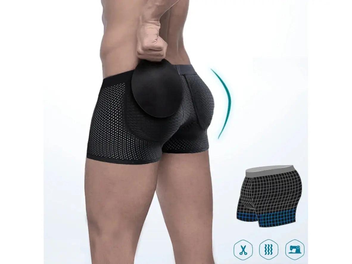 Black removable butt pad boxer briefs showing detached circular pad and perforated mesh sides