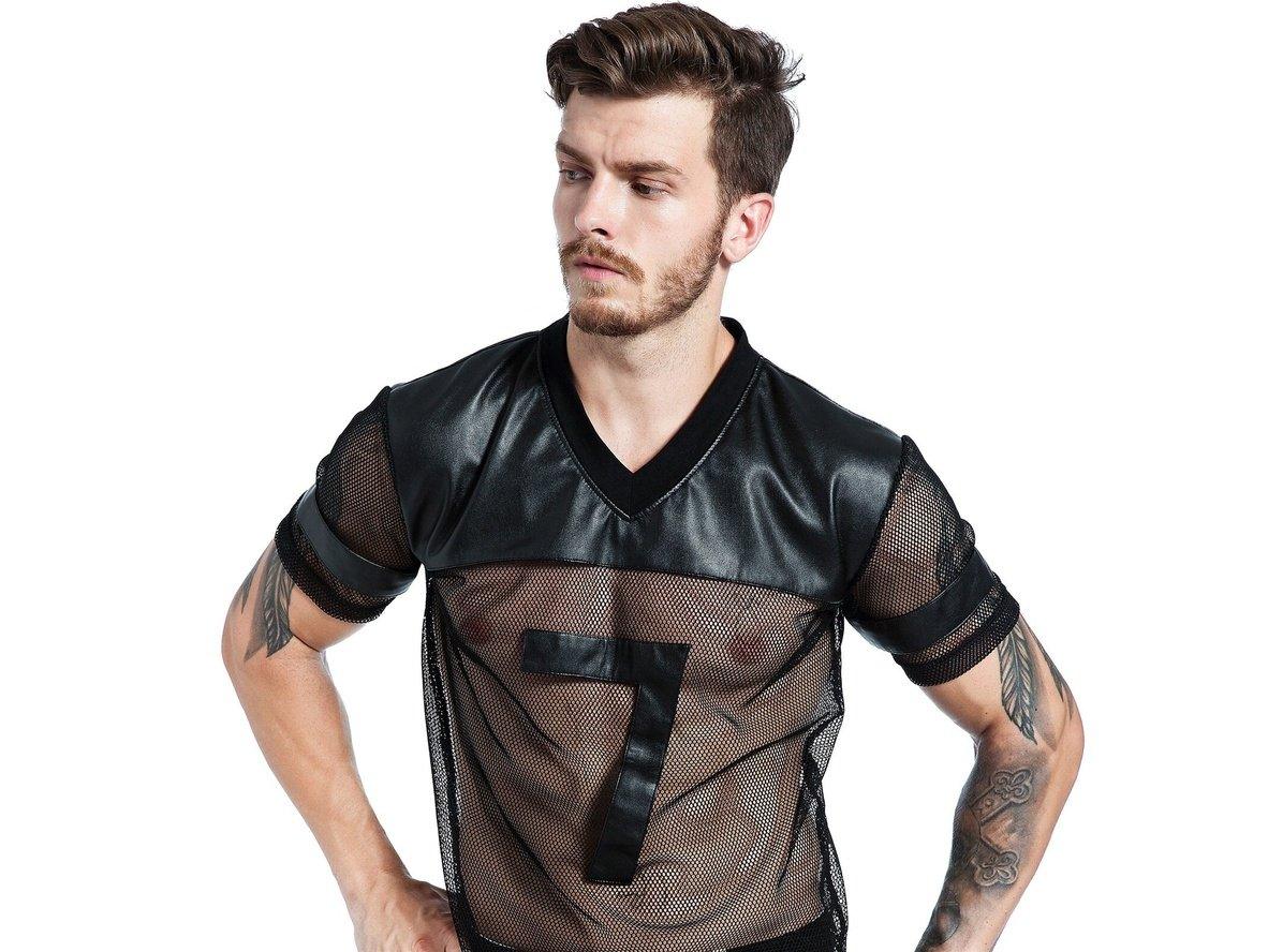 Men's black mesh V-neck top with faux leather yoke and number 7 patch three-quarter profile pose