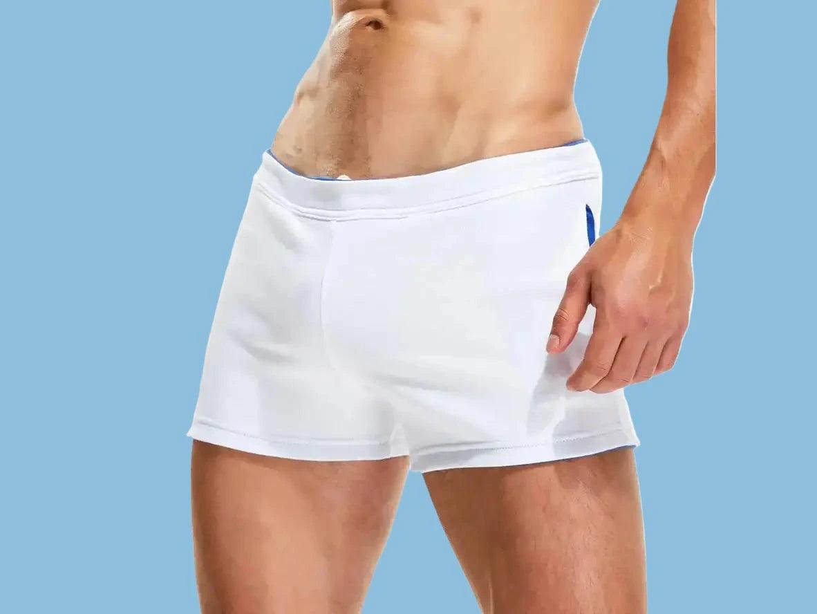 Heather gray activewear shorts with red hip panels and tag back view