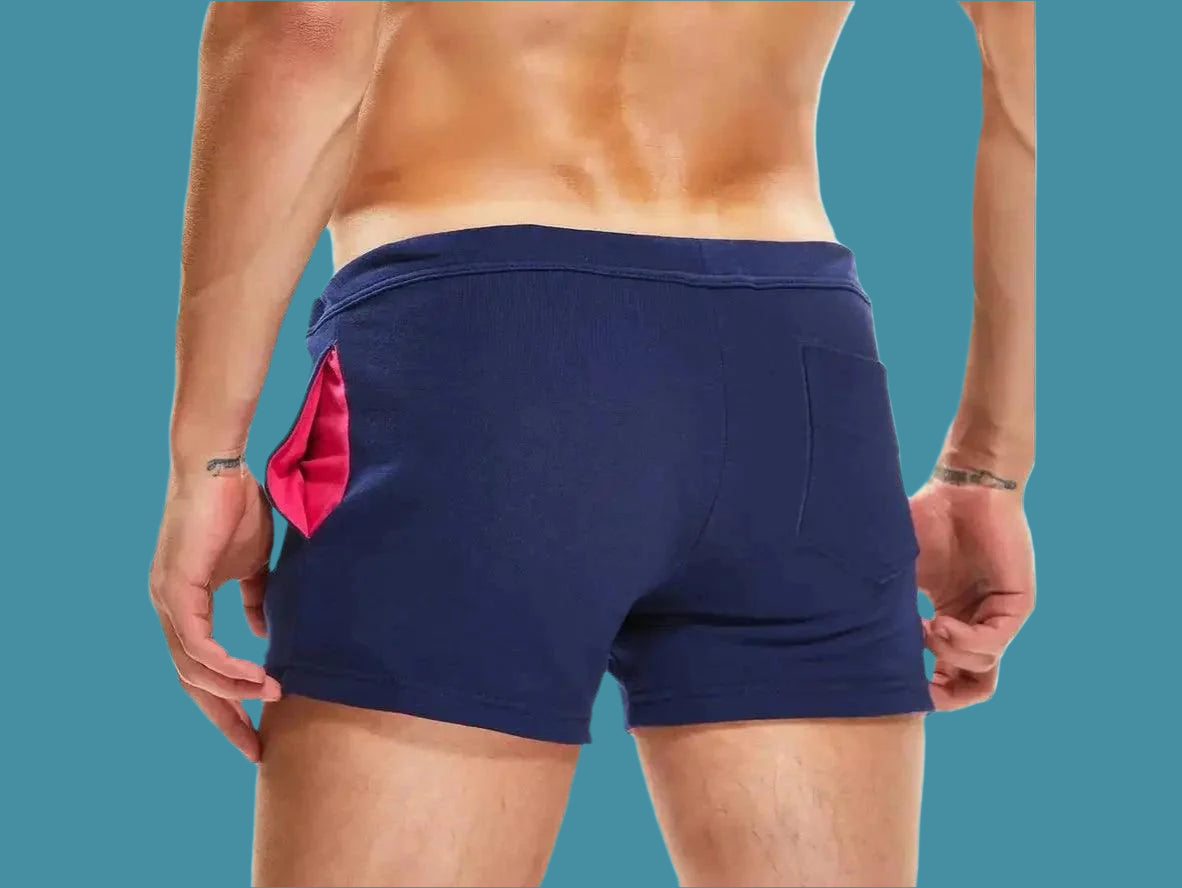 Navy blue gym shorts with pink rear pocket panel back view