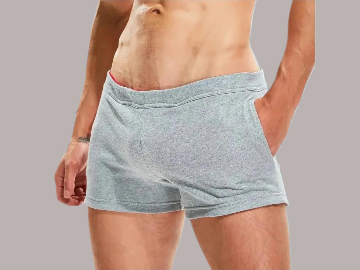 Gray cuffed fitness shorts with red inner waistband lining front view