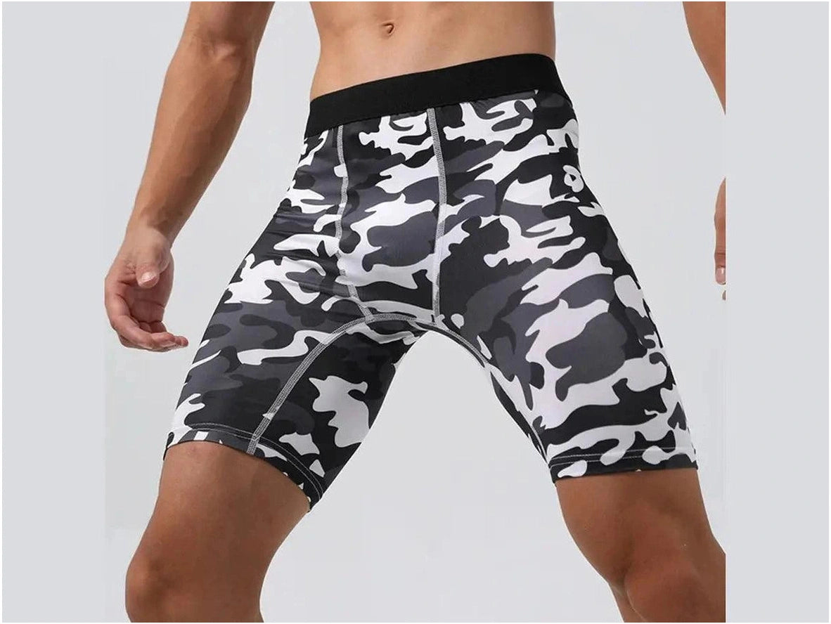 Front view of men's black, white, and gray camouflage compression shorts