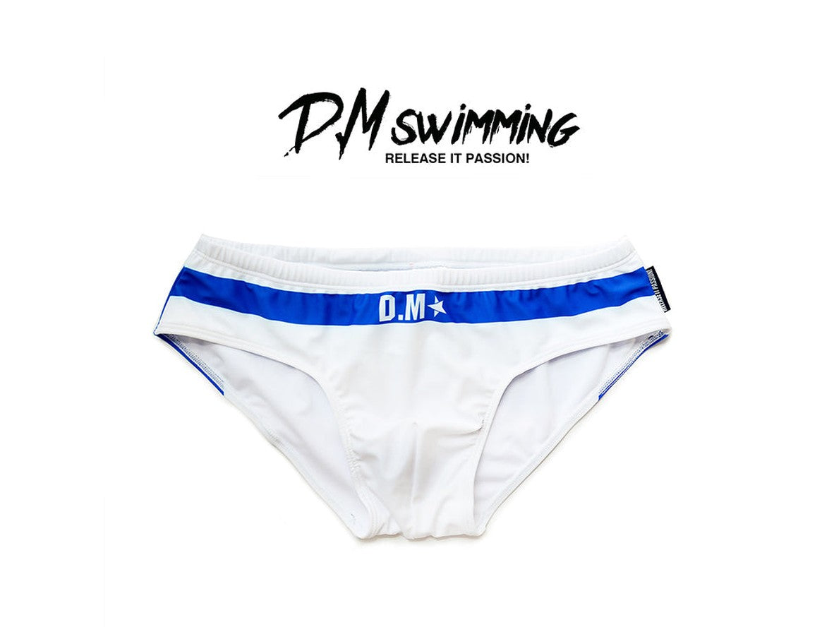 White D.M swim briefs blue waistband with star logo flat lay