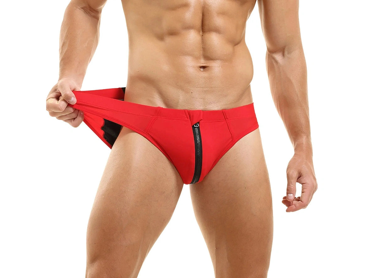 Red low-rise swim briefs showing black zipper and lining