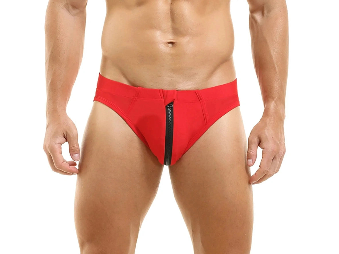 Red low-rise men's swim briefs with centered front zipper