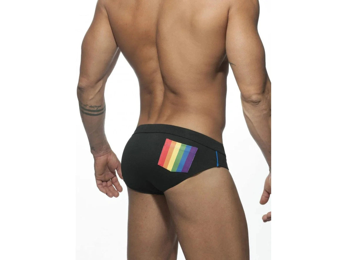 Black men's swim briefs with colorful rainbow pocket on back