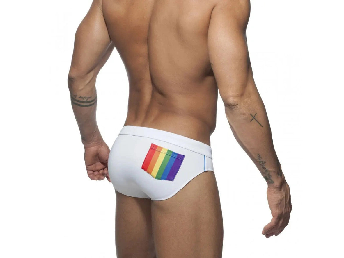 White men's swim briefs with vertical rainbow stripes on back pocket