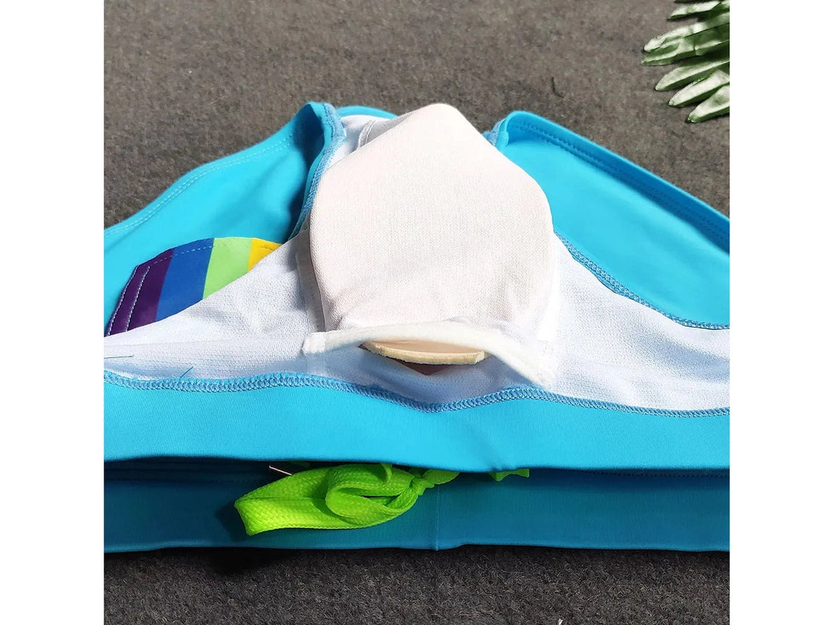 Close-up of blue swim brief interior showing white contoured pushup pad