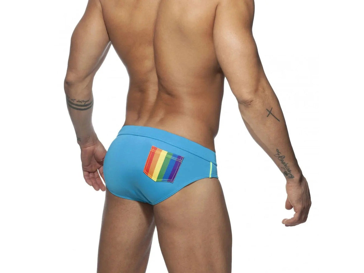 Blue men's pushup pad swim briefs with rainbow pattern detail