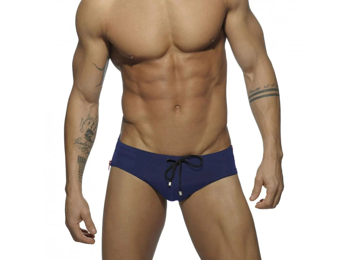 Navy blue low-rise swim briefs with drawstring and side zipper