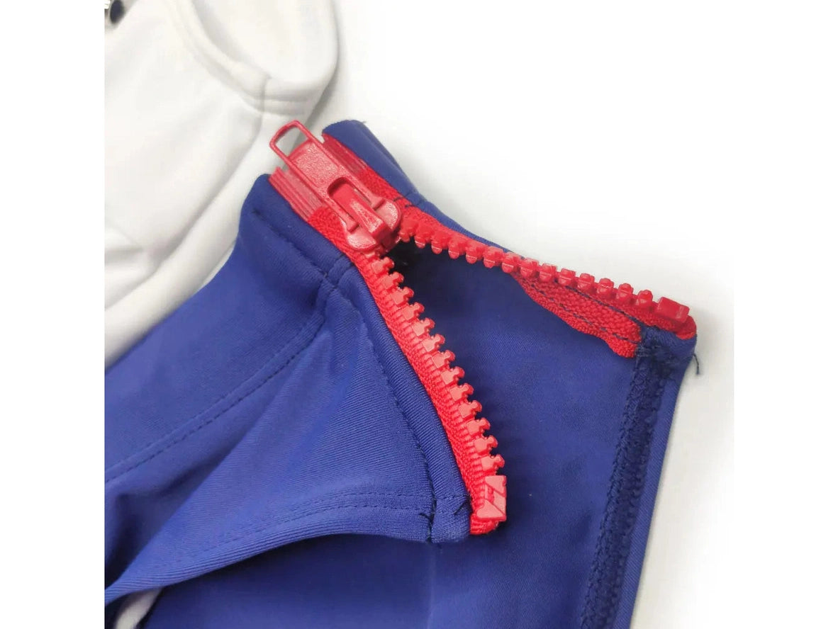 Close-up of blue swimwear fabric with red plastic zipper teeth
