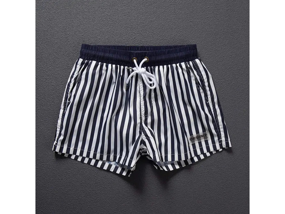 DESMIIT men's navy and white striped swim shorts flat-lay with label