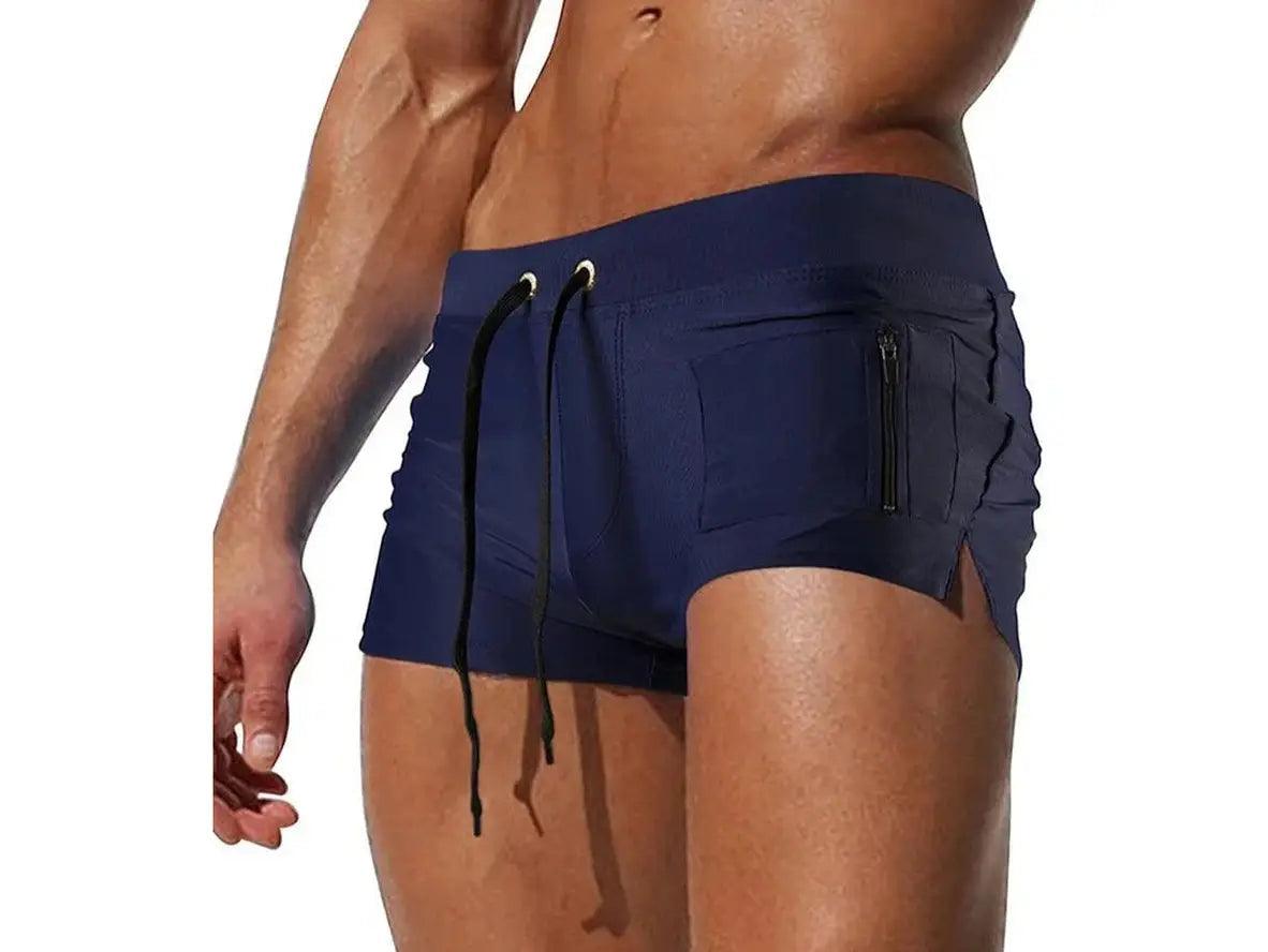 Navy blue men's swim trunks with black drawstrings and right-side zip pocket