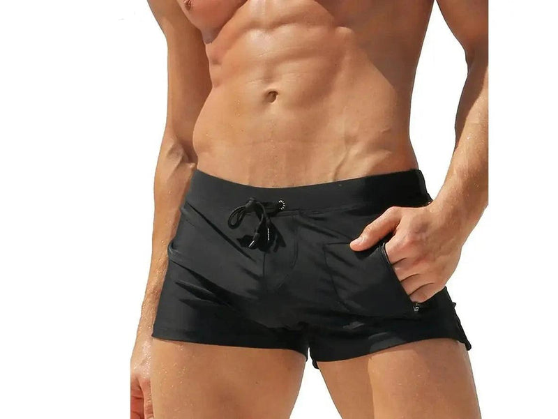 Bright blue men's swim trunks with metal eyelet drawstring and side slit