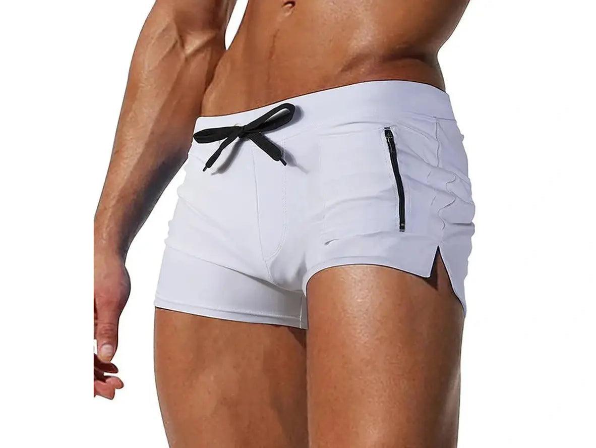 White low-rise men's swim trunks with black drawstring and thigh zip pocket