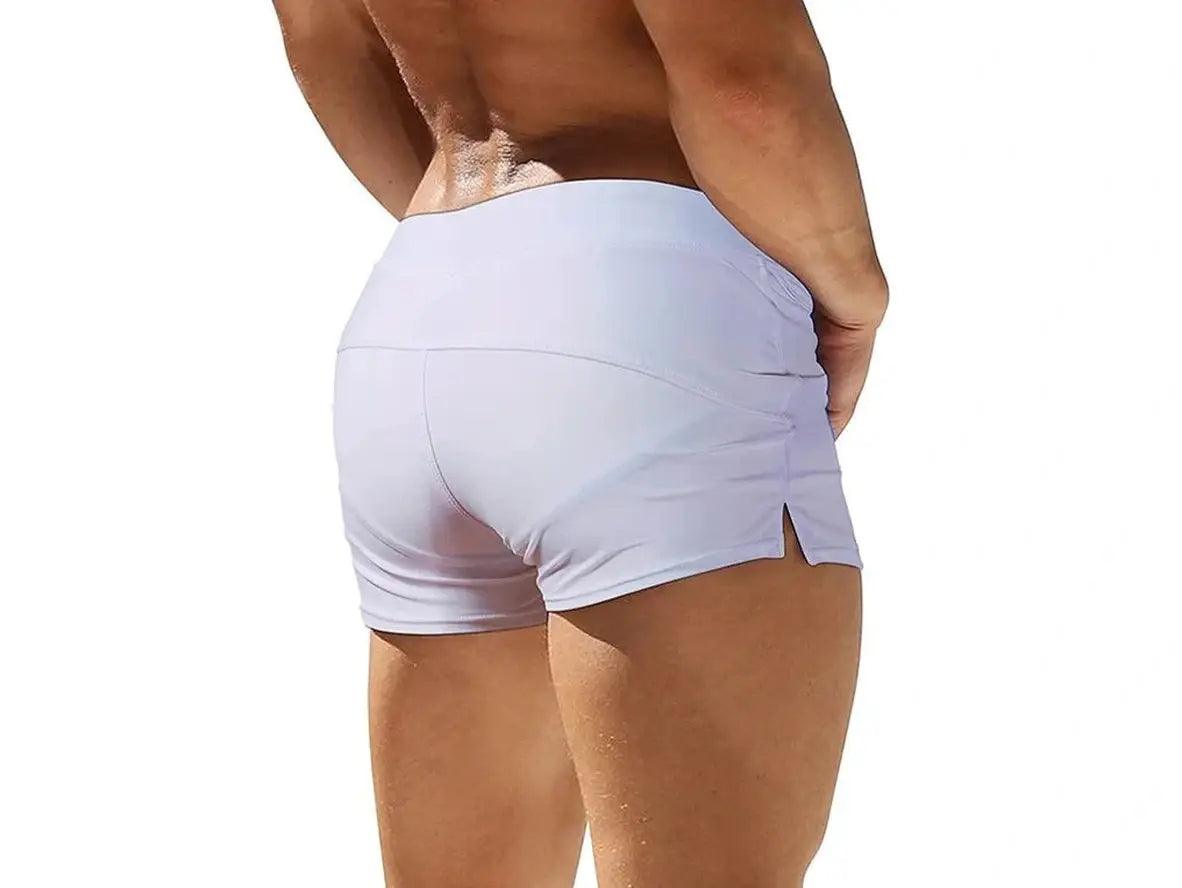Lavender low-rise men's swim trunks with high-waisted back panel design