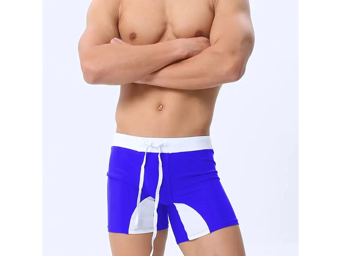 Royal blue swim trunks with white contrast panels and waistband
