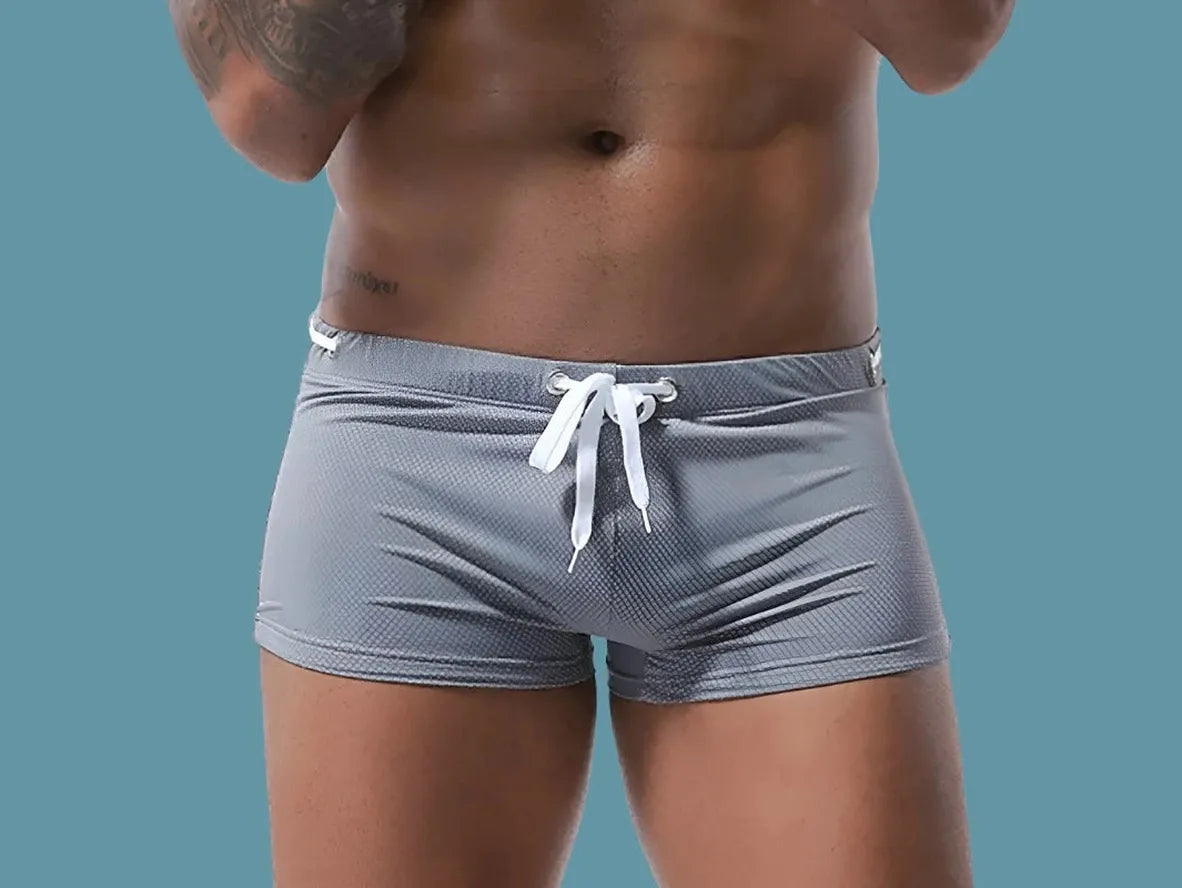 Heather gray low-rise men's swim trunks with fine textured mesh pattern