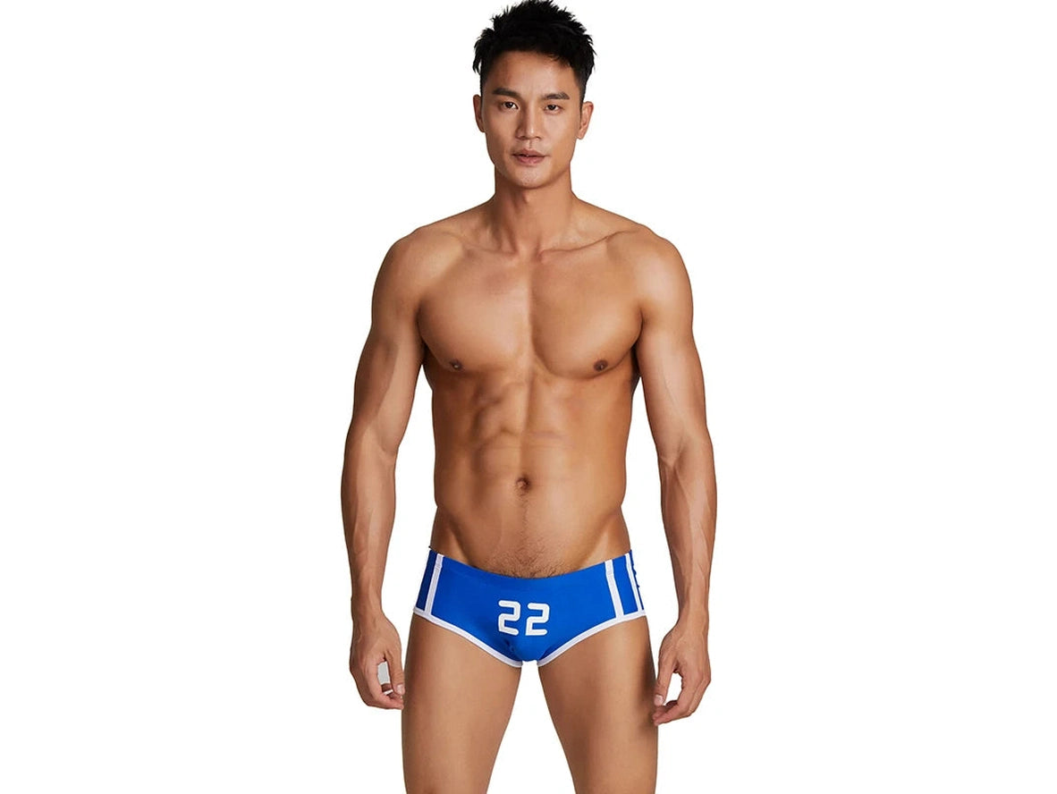 Blue number 22 low-rise swim trunks white background portrait
