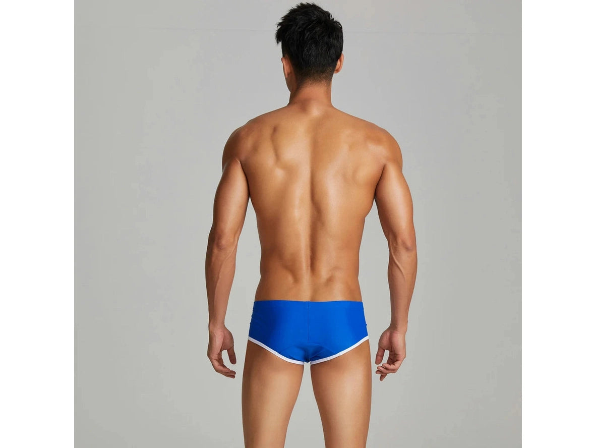 Blue low-rise swim trunks seamless back design detail
