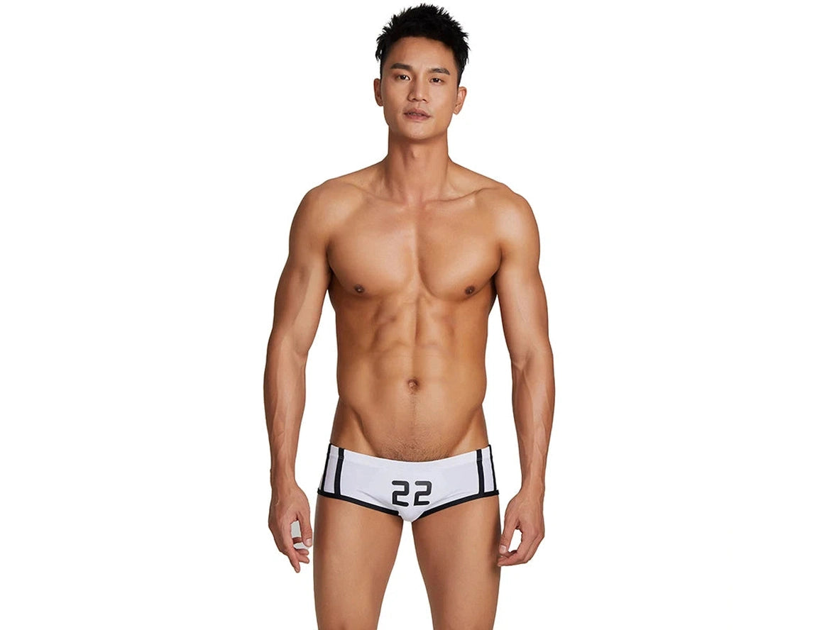 White number 22 low-rise swim trunks with black stripes front view