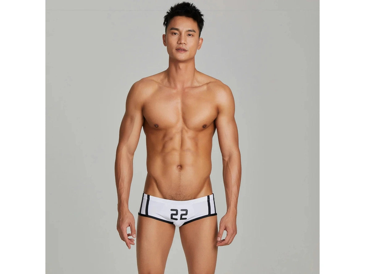 White number 22 low-rise swim trunks with black side stripes