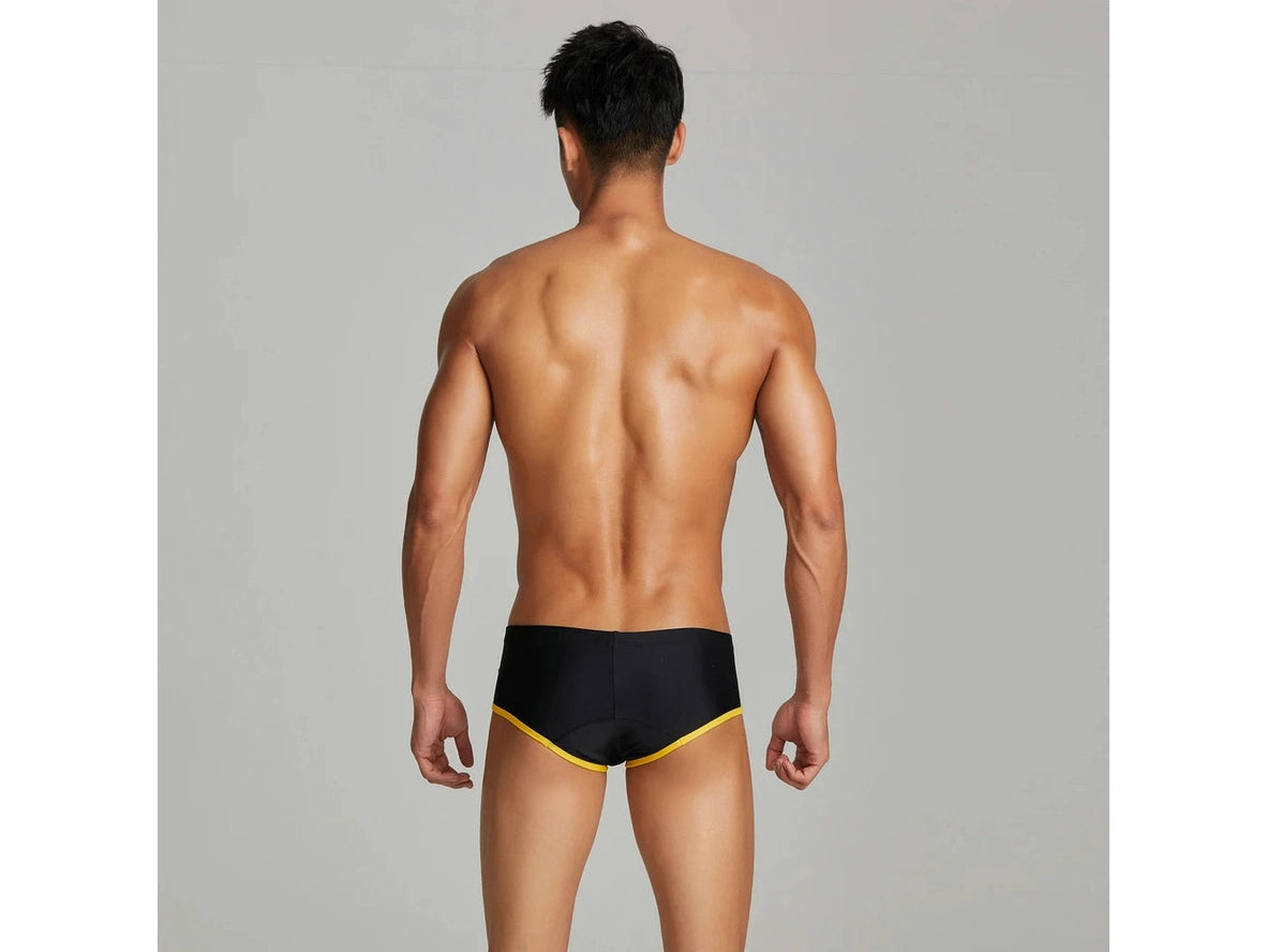 Black low-rise swim trunks central seam back view detail