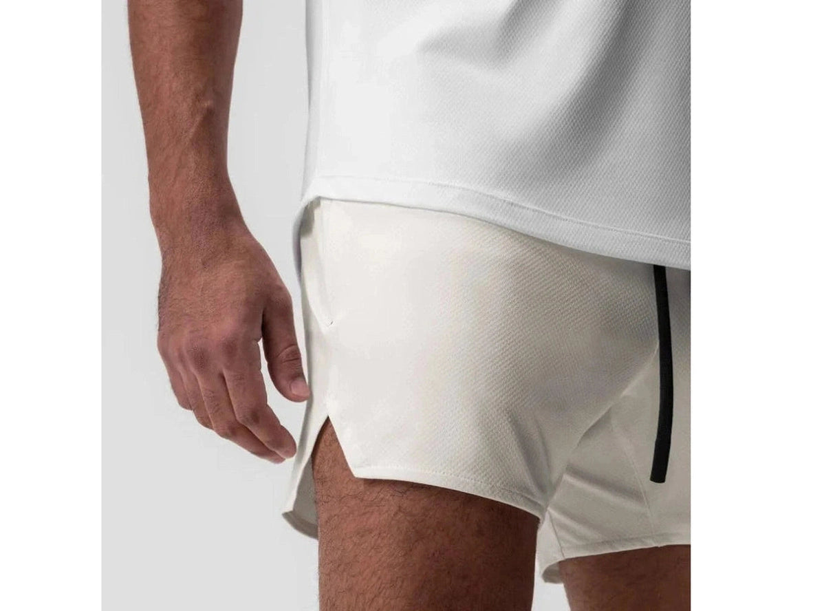 Off-white athletic shorts with black stripe and curved hem slit detail
