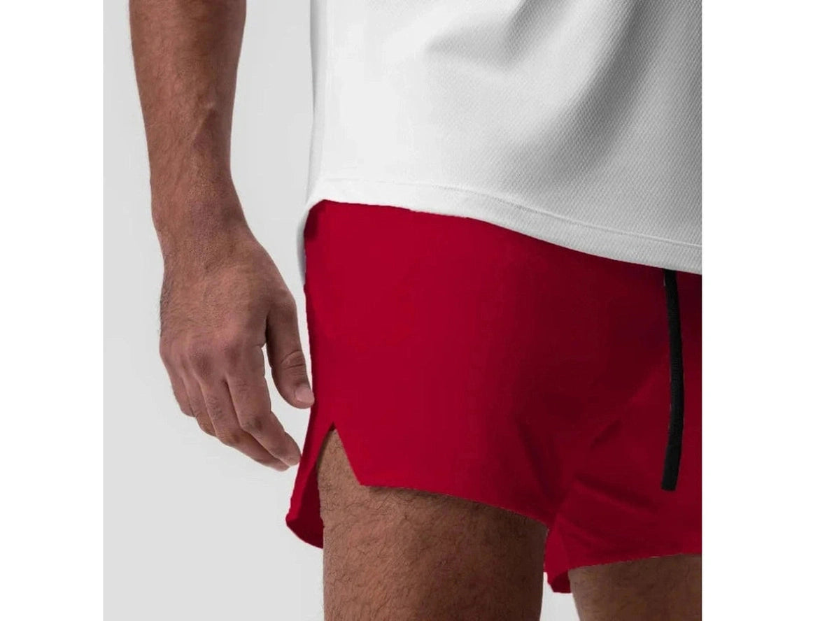 Red men's gym shorts with diagonal side slit and black seam detail