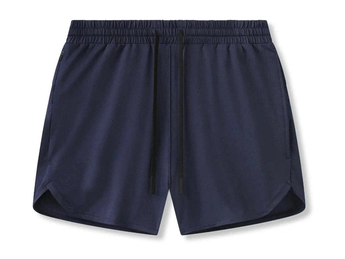 Navy blue gym shorts flat lay featuring elastic waist and side zippers