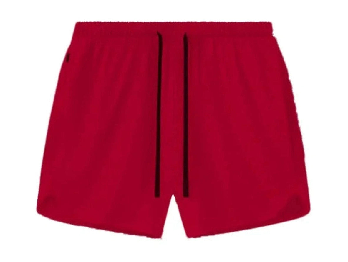 Red men's athletic shorts flat lay showing smooth stretch fabric