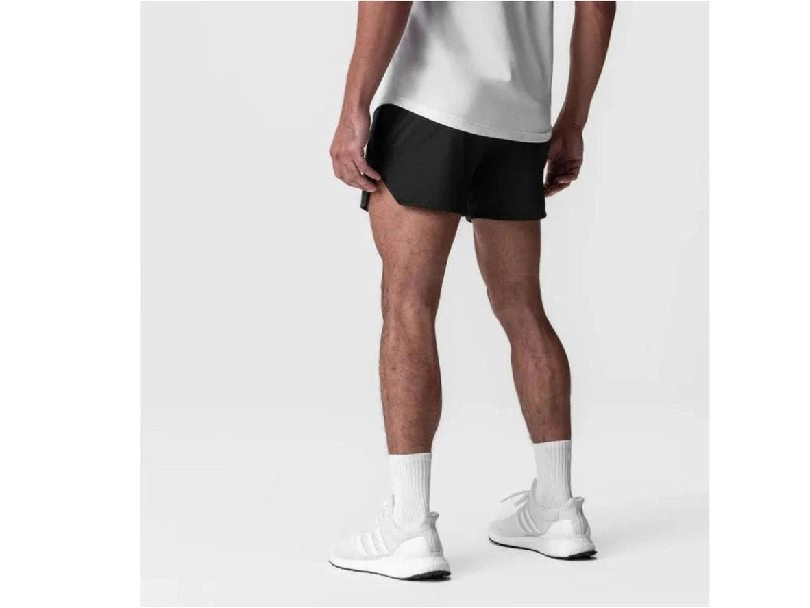 Back view of black mid-thigh athletic shorts with seamless construction