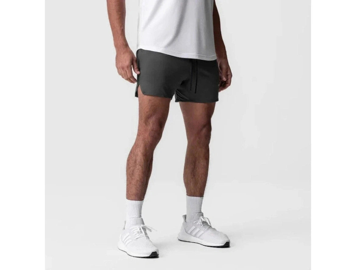 Dark gray relaxed fit gym shorts with elastic waistband and side slits