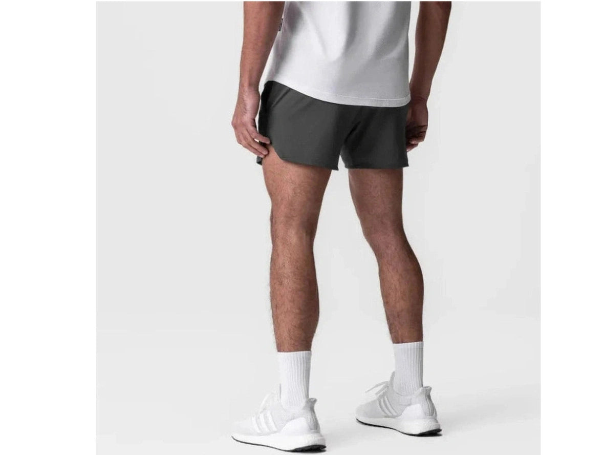 Dark gray mid-thigh athletic shorts rear view with curved hemline