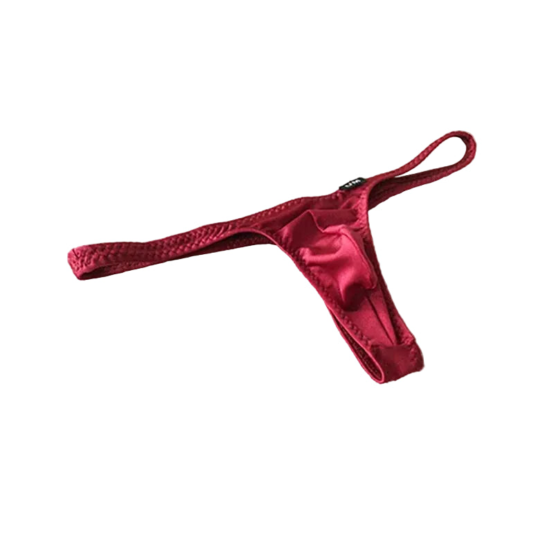 Red satin thong on a beige fabric background with 'UNDER MOON' branding.