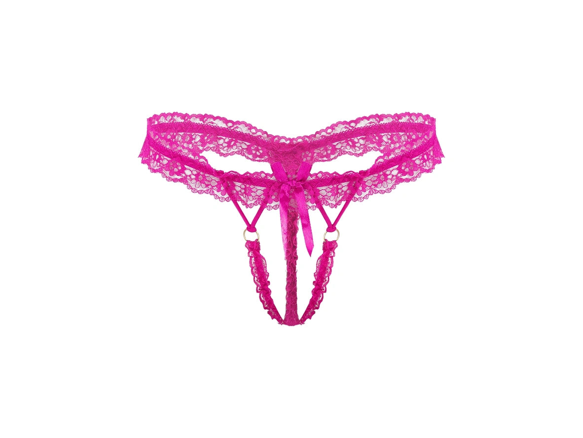 Bright pink lace thong with a matching lace waistband, front tie bow, and attached lace leg straps with small gold-tone rings, shown on a plain white background.