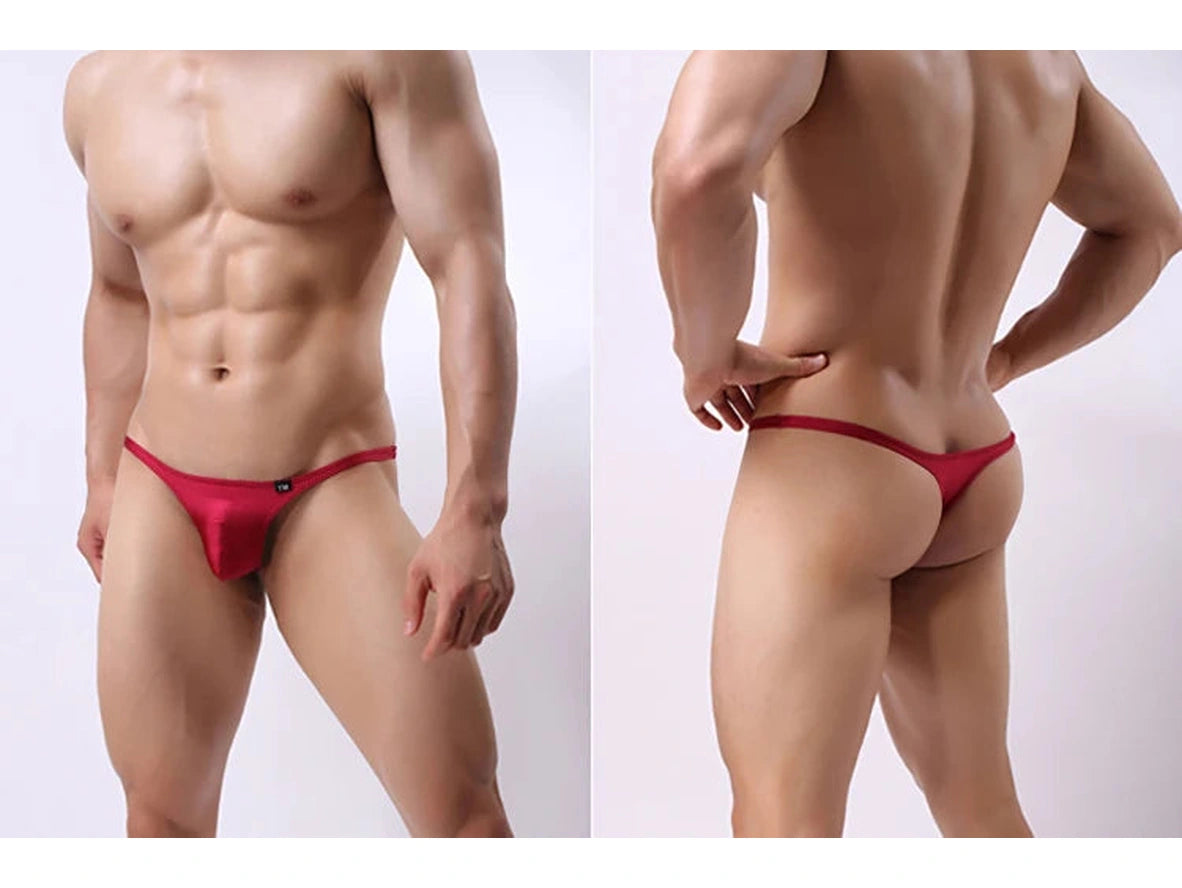 Red men's underwear worn by a muscular person on a white background