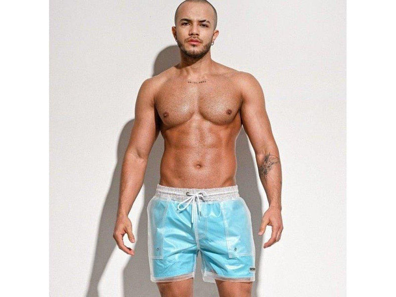 Blue transparent swim shorts worn by model with sleeveless mesh top