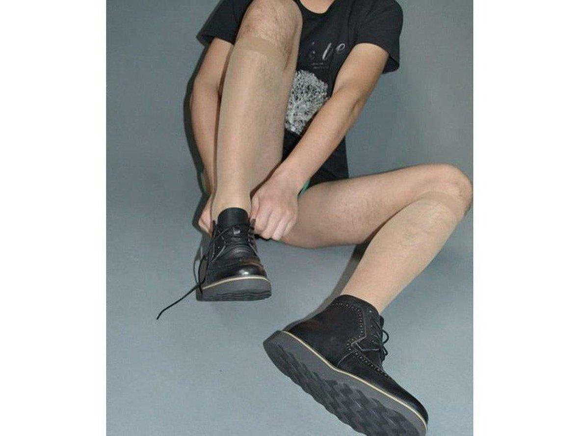Sheer male pantyhose worn with black lace-up boots for full leg styling