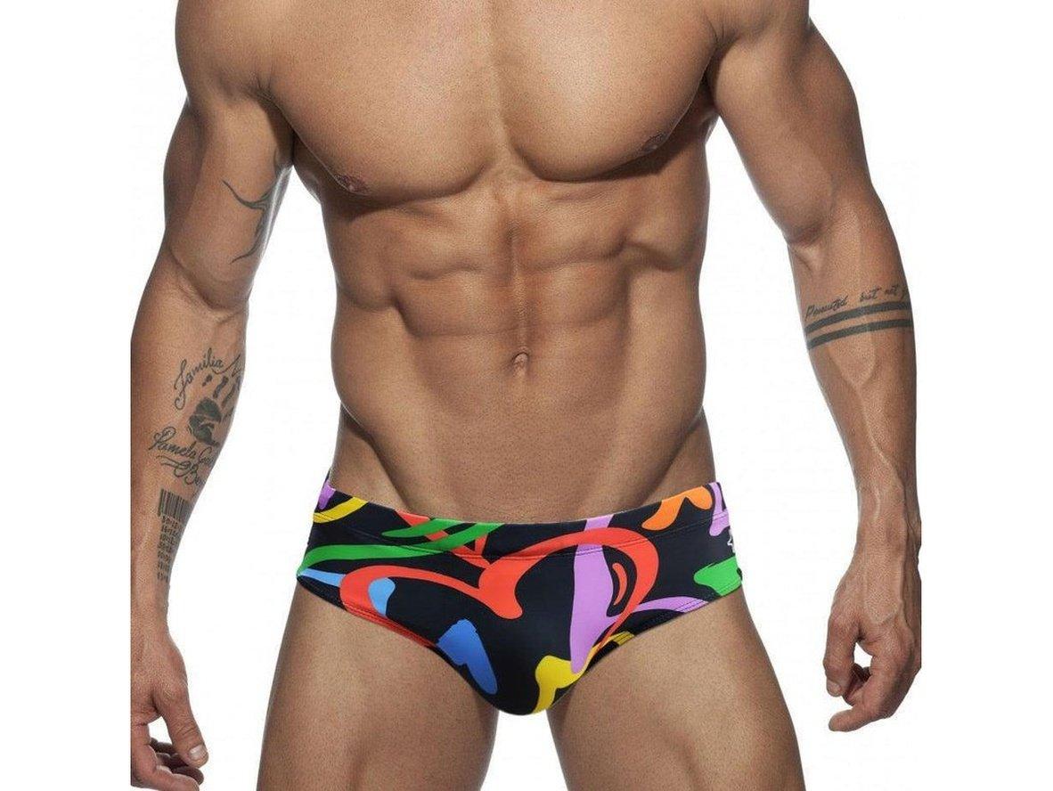 Men's black swim briefs featuring bold rainbow heart swirl design